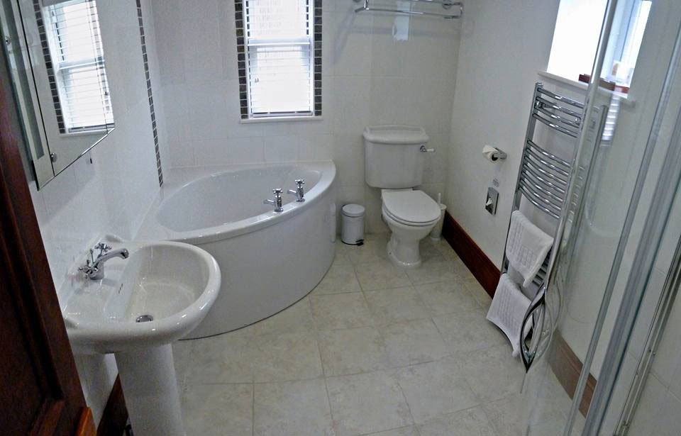 Style Plumbing & Heating bathroom installation with corner bath