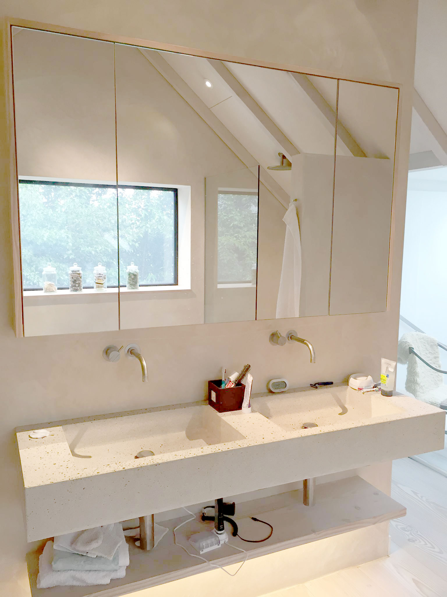 Style Plumbing & Heating double sink bathroom with large mirrors